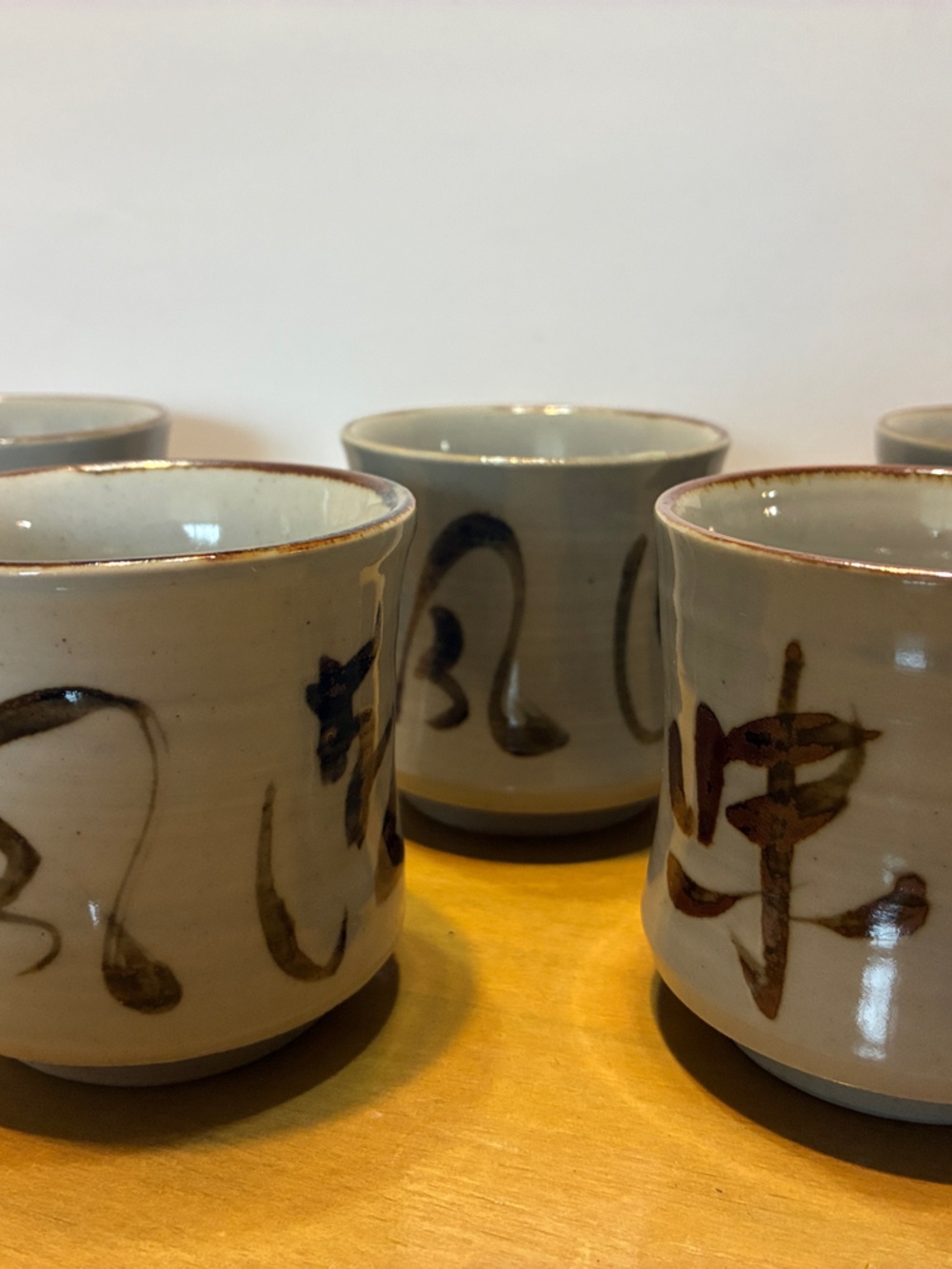 Hand-Painted Ceramic Saki Cups in Cream with Brown Brushstroke Accents